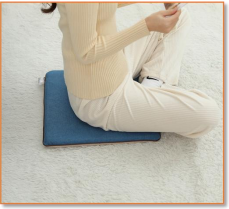 Close-up of the cotton-linen surface on a SunAura heated chair pad