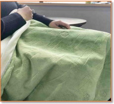 Detail of the plush fleece texture on a SunAura heated throw